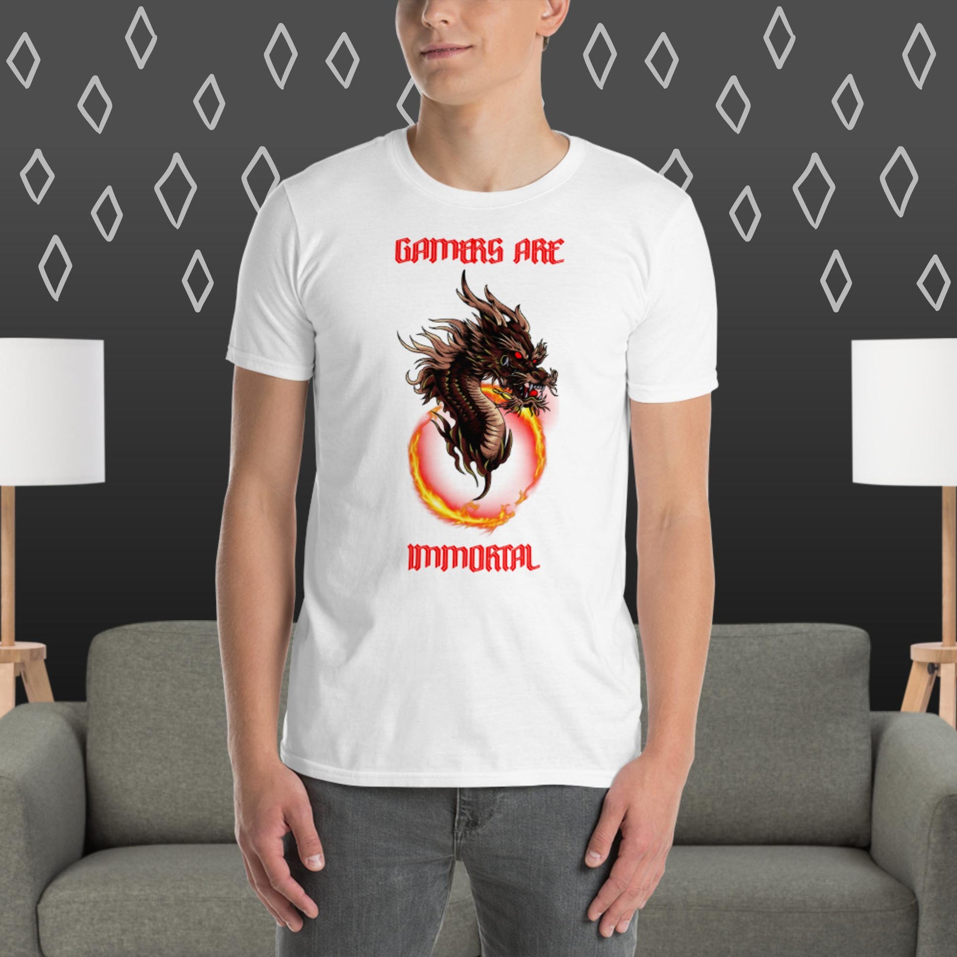 Man in white t-shirt with gamers are immortal and a dragon coming out of fire ring printed on