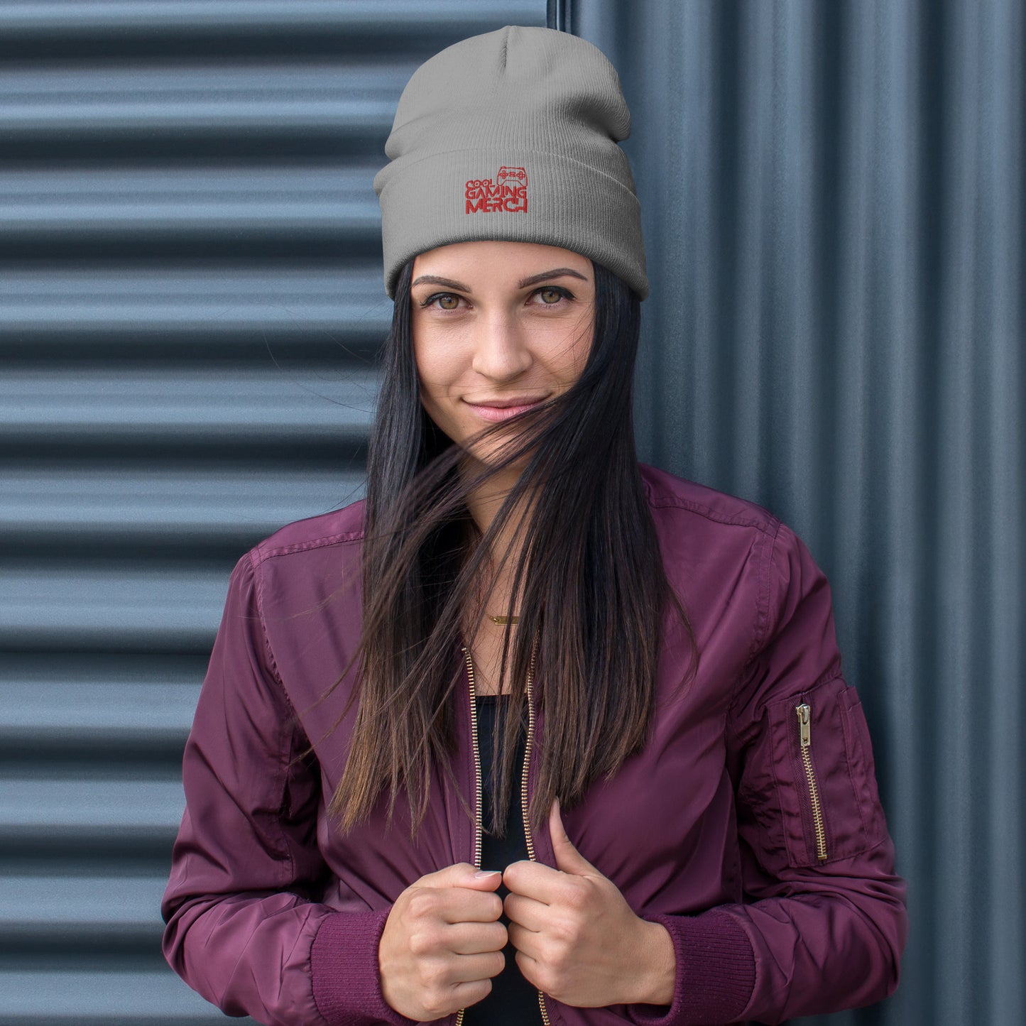 Woman wearing grey beanie hat with cool gaming merch logo