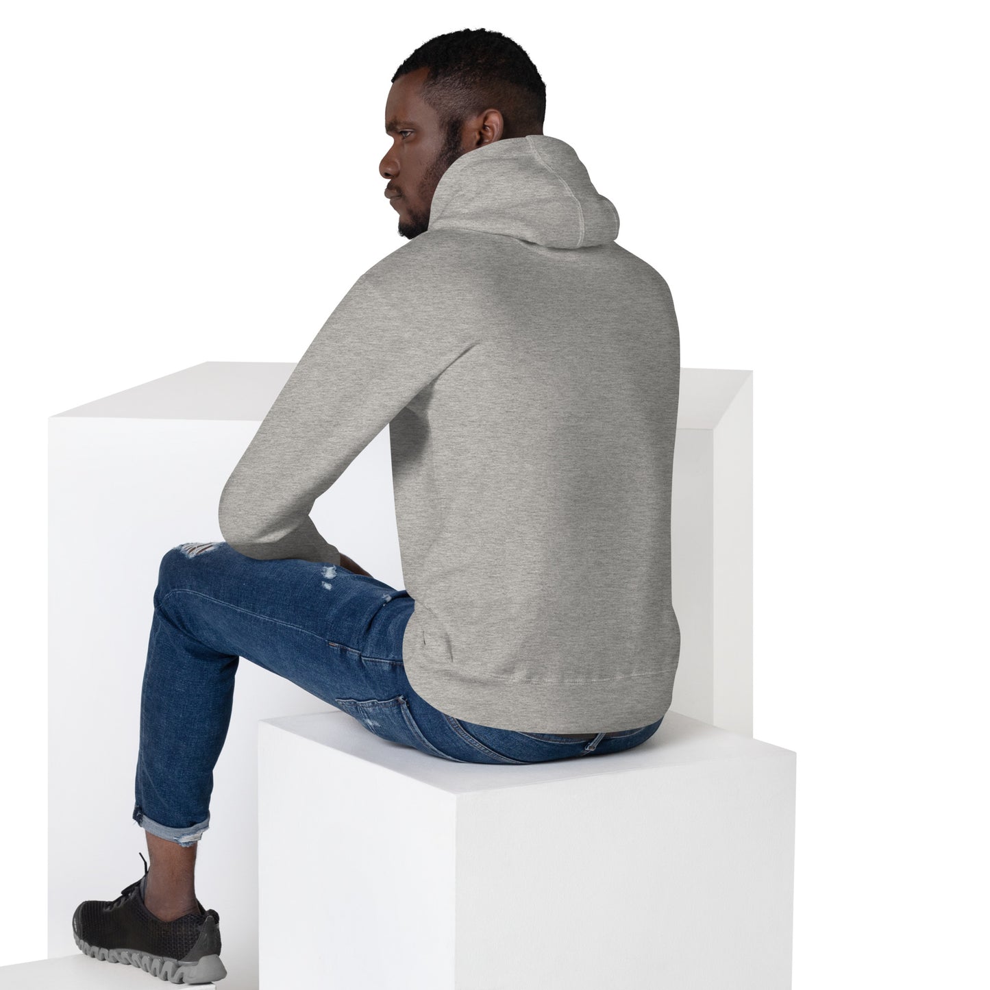 Man in carbon grey hoodie, sitting away from camera