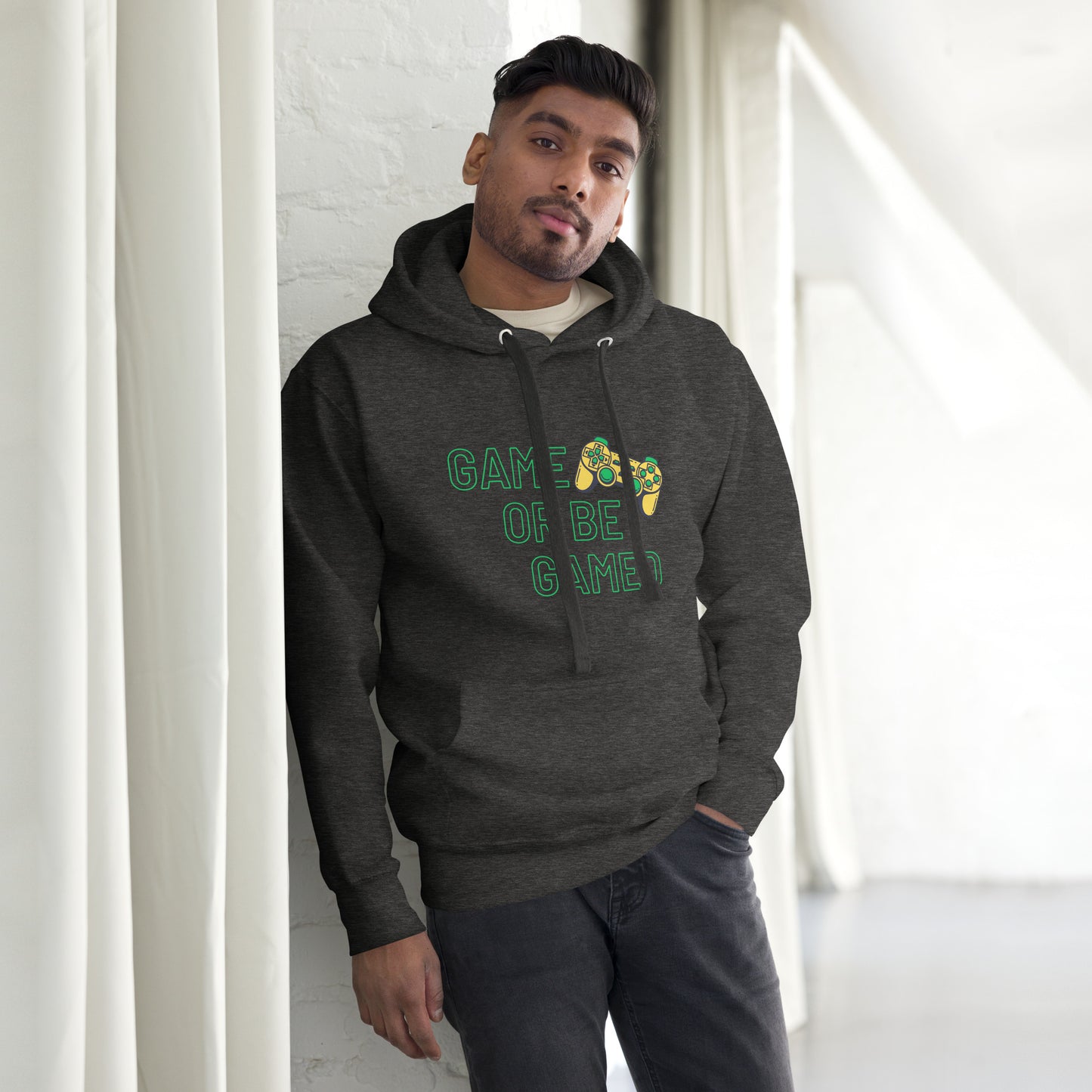 Man in charcoal-heather hoodie that says game or be gamed