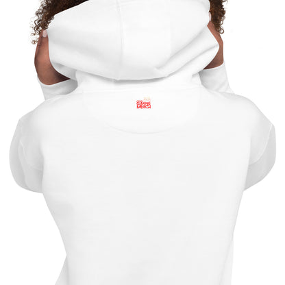 Woman, facing away in white hoodie with outside label (close camera)