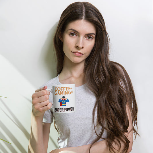 Woman holding white glossy mug that says coffee + gaming = superpower
